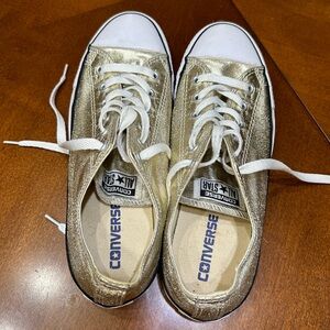 Gold Converse sneakers